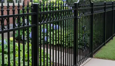 Black ornamental metal fence installation by Chop Chop Landscaping in St Paul, MN